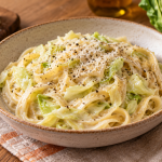 Creamy Alfredo pasta with tender cabbage ribbons, Parmesan and black pepper