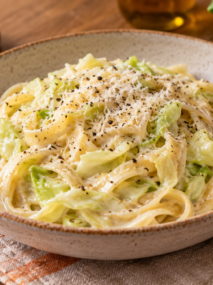 Creamy Alfredo pasta with tender cabbage ribbons, Parmesan and black pepper